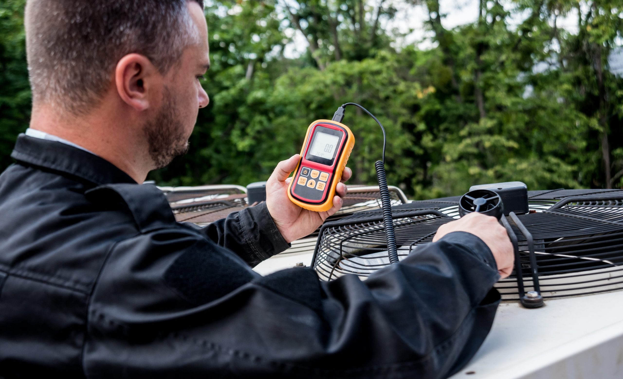 HVAC maintenance professional inspecting system