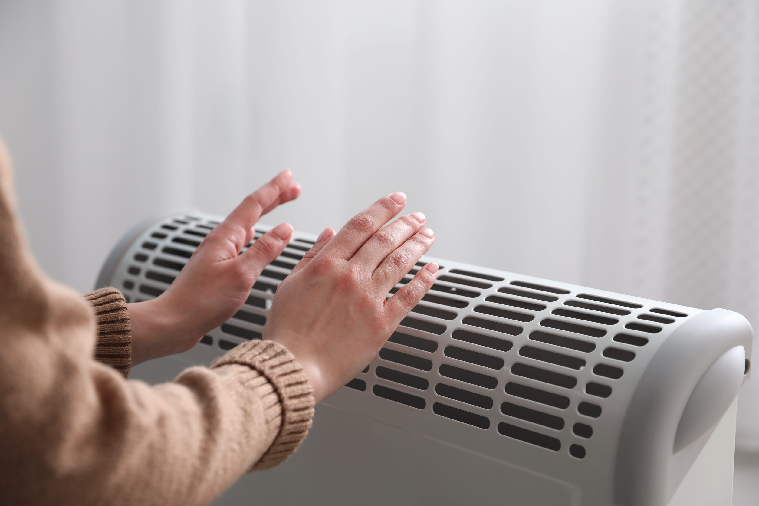 Person enjoying their heating system in Roanoke, VA